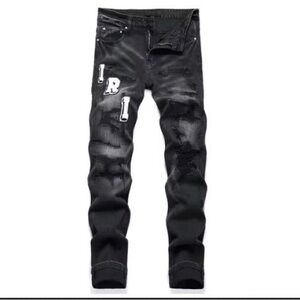 AMIRI Black Relaxed Jeans with Letter Patches